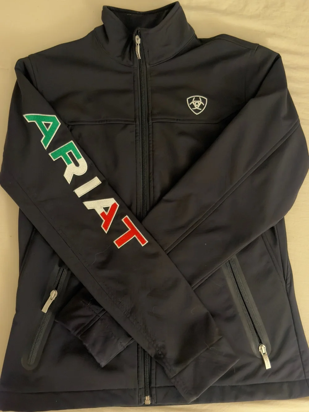 Women’s Ariat Black Softshell Jacket with Green, White & Red Sleeve Logo